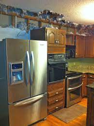 The soffit is the area across the top and the ceiling of the kitchen cabinets. Removing Soffits Above Kitch Cabinets Bella Tucker