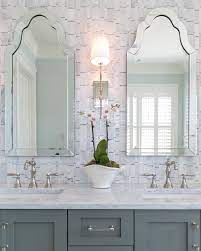 The glenford wall sconce by hudson valley lighting has a rectangular backplate with notches that hold a sweeping, vertical arm with an unexpected angular detail. Our Glenford Sconce Along With Dreamy Marble Beautiful Cabinetry And Striking Mirrors Design Bathroom Design Black Pretty Bathrooms Spa Inspired Bathroom