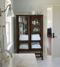 Check out our glass front cabinet selection for the very best in unique or custom, handmade pieces from our furniture shops. Pretty Bathroom Storage Ideas Plus Our Master Bath Reveal