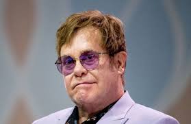 Sir Elton John working