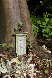 If i want all natural materials i have some dried gourds, and i could use the scrap from cutting a door shaped opening in one of those gourds for its door. Fairies
