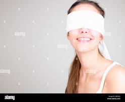 Woman blindfolded, smiling Stock Photo - Alamy
