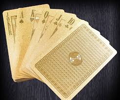 The other deck has gold gilt edges and 2 storks. Gold Playing Cards