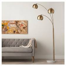 By artiva (8) lumiere modern 80 in. Threshold 3 Globe Arc Floor Lamp Antique Brass Gold Floor Lamp Floor Lamps Living Room Modern Floor Lamps