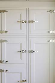 ivory kitchen cabinets with chrome