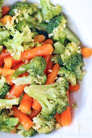Steamed Broccoli And Carrots With Garlic And Oil Sauce Steam Vegetables Recipes Veggie Dishes Veggie Side Dishes