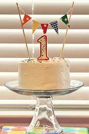 Add a few balloons or streamers and a birthday sign to blank wall space, and you'll keep the focus on baby's big moment. Little Inspirations Bright 1st Birthday 1st Birthday Cakes First Birthday Cakes Birthday Cake Kids