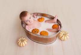 Once they no longer have their umbilical stump, you can begin giving them more. Houston Newborn Photography Cypress Kimberly Rachelle Photography Fall Baby Photos Baby Milk Bath Baby Photoshoot Boy