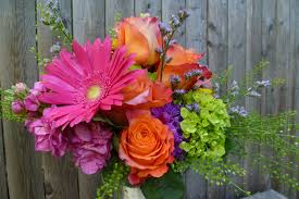 We provide award winning designs and service, and are recognized in the floral industry as one of the very best. Summery Bright Bridal Bouquet Feauring Hot Pink Gerbera Daisies Lime Hydrangea Free Spirit Roses A Free Spirit Rose Pink Gerbera Floral Arrangements Wedding