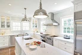 white kitchen cabinets with stainless