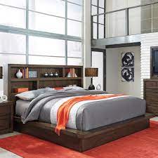 Bed is available in queen & king sizes. Riva Ridge Modern Loft King Bookcase Platform Bed In Brownstone Nebraska Furniture Mart