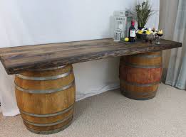 Two Barrels Topped With Wood Planks Will Create The Beverage Station Wine Barrel Furniture Wine Barrel Table Barrel Table