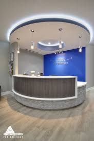 Blue And Stone Modern Reception Desk Dental Office Design By Arminco Inc Medical Office Decor Medical Office Design Dental Office Design