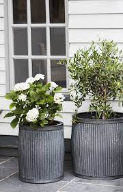 In the meantime, i'll go ahead and get myself ready for the day that i can finally fill my front porch with flowers by choosing the planters that i want to i've rounded up a great selection of farmhouse style planters for under $50. 11 Ways To Create A Charming Country Cottage Style Garden Potted Plants Outdoor Large Outdoor Planters Flower Pots Outdoor