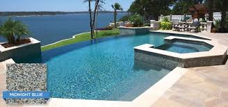 This Infinity Edge Pool Utilizes Crystal Stones Midnight Blue Plaster To Beautifully Match The Water In The Lake In Sala Pool Finishes Pool Plaster Pool Colors