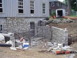 Adding Field Stone Facade To Foundation With Retaining Wall Stone Siding Exterior Old Farm Houses House Exterior