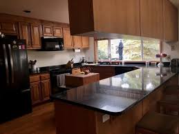 Dark cabinets don't have to be black—if the midnight mood isn't for you, consider a lighter shade of brown. Kitchen Cabinet Hardware Ideas