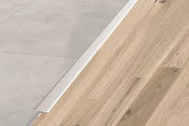Transition pieces for laminate flooring. Transition Strips
