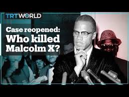 A photograph of malcolm x rests on a chair at a commemorative gathering on his birthday. Malcolm X Case To Be Reopened After Netflix Documentary Youtube