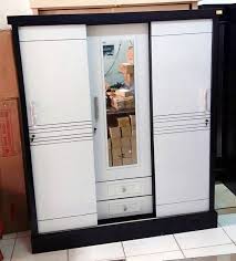 Bahan baku utama menggunakan kayu mahony. Harga Lemari Triplek 3 Pintu Lemariweuh