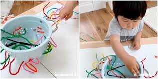Easier toddler fine motor activities. Colander Pipe Cleaner Fine Motor Skills Activity For Toddlers Hello Wonderful