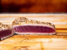 Heat olive oil in a large, heavy skillet until it shimmers. How To Grill Tuna Steaks