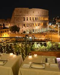 Outdoor restaurant with tables and chairs under tree branches in town of sirmione, italy. 4 Rome Restaurants With Remarkable Views Forbes Travel Guide Stories Rome Restaurants Italy Restaurant Rome Vacation