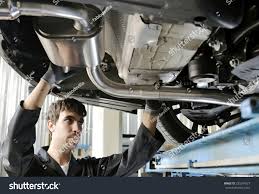 Mechanic Under Car Installing Exhaust Pipe Stock Photo Edit Now 235354027