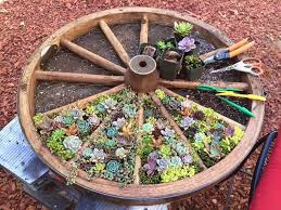 Wagon Wheel Herb Garden Design Ideas The Whoot Diy Flower Pots Succulents Wagon Wheel Garden