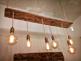 Creazioni Uniche Di Alto Artigianato Realizzate Con Legno Marino Per Meravigliose Atmosfere Design Lampad Luci Di Legno Lampadari Rustici Lampadario In Legno