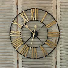 Black And Gold Wall Clock Uk Black And Gold Skeleton Wall Clock A Large Bold Statement Clock With A Black Metal Frame And Gold Aged Skeleton Wall Clock Vintage Wall Clock Wall Clock Design