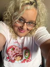 Sporting my strawberry shortcake today . Don't care if I am 52