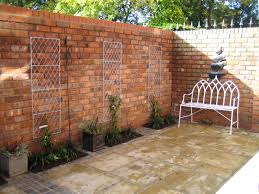 Reclaimed Brick Walls In A Small Courtyard Garden From A Garden Design By Sue Davis Www Outside Roo Small Courtyards Small Courtyard Gardens Brick Wall Gardens