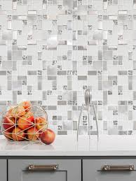 Handmade dichroic glass tiles are inset to create a unique kitchen backsplash. Glass Backsplash Tile Clean Look Modern Traditional Backsplash Com