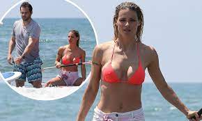 + body measurements & other facts. Michelle Hunziker Dons Orange Bikini As She Goes Paddle Boarding With Husband Tomaso Trussardi Daily Mail Online