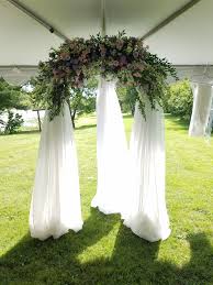 15 gorgeous winter wedding bouquets Outdoor Wedding Arch Flower Arch Purple And Pink Wedding Flowers Draping Arch Flowers With Dra Outdoor Wedding Wedding Arch Flowers Wedding Arches Outdoors
