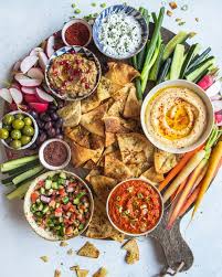 Middle Eastern Inspired Layer Dip With Hummus Muhammara Baba Ganoush Herbed Labneh And Shirazi Salad Recipe By Molly Adams The Feedfeed Recipe Eastern Cuisine Middle Eastern Recipes Food Platters
