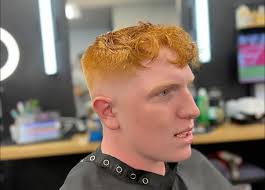 Low drop fade with a textured fringe