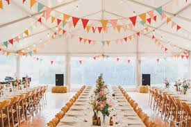 Marquee Wedding Clear Walls White Roof Festoon Lighting Trestle Tables Wooden Padded Folding Chairs Marquee Wedding Wedding Chairs Wooden Folding Chairs