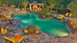 The crystal blue pool and slate paving stones make this patio an outdoor oasis. 15 Swimming Pool Decks With Stone And Pavers Home Design Lover