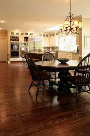 Is there a simple solution to finishing the new red oak to match an aged golden white oak? Picture Of The Kitchen With White Cabinets And Dura Seal Coffee Brown Sta Dark Hardwood Floors Living Room Living Room Hardwood Floors Stained Kitchen Cabinets