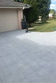 Use a bristle brush to scrub the concrete and rinse the area with fresh water. Concrete Resurfacing Ben Hall Roof Driveway Restorations Port Macquarie