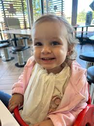 Remove white napkin from photo without altering face?