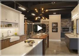 Blurred image of the exhibition stand: Custom Cabinetry Elevations By Hines Premier Kitchen Bath Showroom