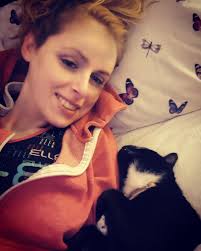 This is how I wake up with my adorable kitty, Edith every morning. She's  the cutest little cuddle bug!