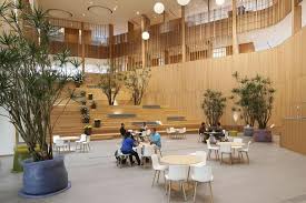 The Building S Double Height Atrium In 2020 Wood Interiors Board Design Architecture