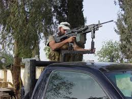 File:Layne Morris weilds a SAW mounted