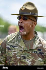 U.S. Army Staff Sgt. Brandon Curry, a drill sergeant with the 1st Bn.,  390th Inf. Reg., yells orders to Junior Reserve Officer Training Corps  (JROTC) cadets during an encampment here, June 21,