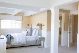 Light Gray Linen Wingback Bed With Gold Sconces Transitional Bedroom