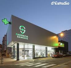 Inside The Pharmacy Ceiling Lights Guide The Client To The Counters While Sales Areas Are Arranged On The Back Pharmacie Design Agencement Pharmacie Pharmacie